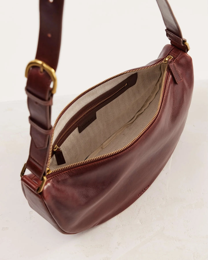 Juju | Crescent Leather Sling Handbag | Maple