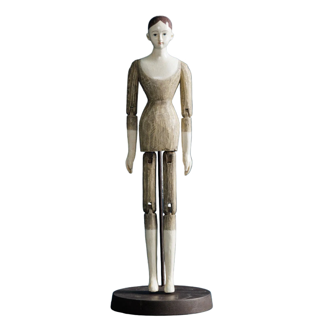 Wooden mannequin figure on a blue background